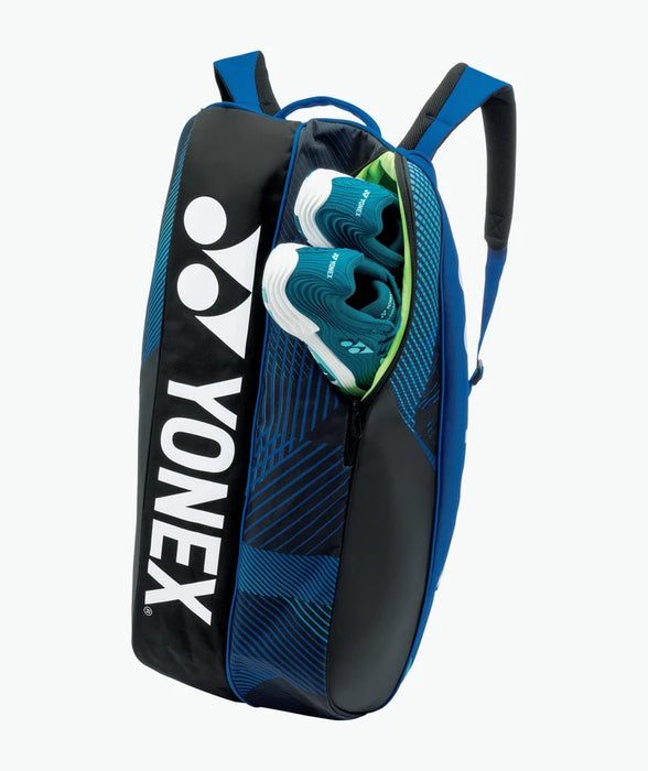 Yonex Pro Racquet Bag 6 Cobalt Blue upright view with shoe compartment open and Yonex court shoes inside