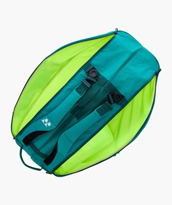 Yonex Pro Racquet Bag 6 BA92426 Teal Green opened to show padded backpack straps and bright green interior compartments