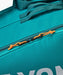 Yonex Pro Racquet Bag 6 BA92426 in Teal Green close-up showing zippered compartment with orange zipper pulls