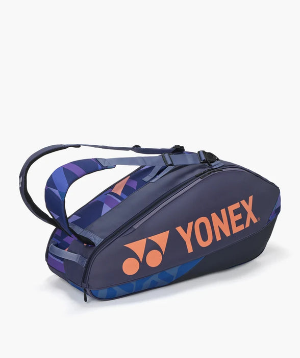 Yonex Pro Racquet Bag 6 Midnight Navy side view with orange Yonex logo and adjustable backpack straps