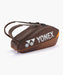 Yonex Pro Racquet Bag 6 Espresso Brown side profile with silver Yonex branding and backpack carrying straps