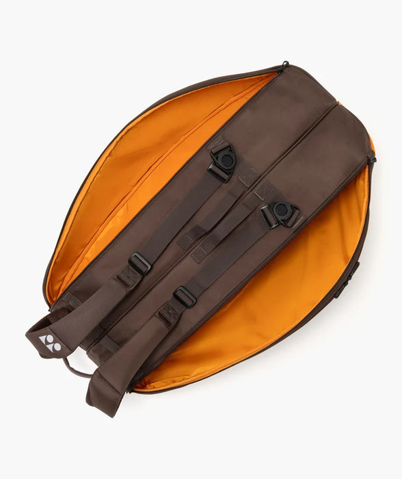 Yonex Pro Racquet Bag 6 Espresso Brown open compartment view showing backpack straps and orange interior lining