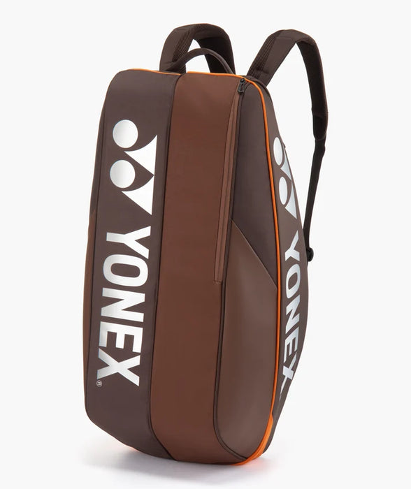 Yonex Pro Racquet Bag 6 Espresso Brown upright front view with large silver Yonex logos and orange trim