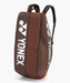 Yonex Pro Racquet Bag 6 Espresso Brown upright front view with large silver Yonex logos and orange trim
