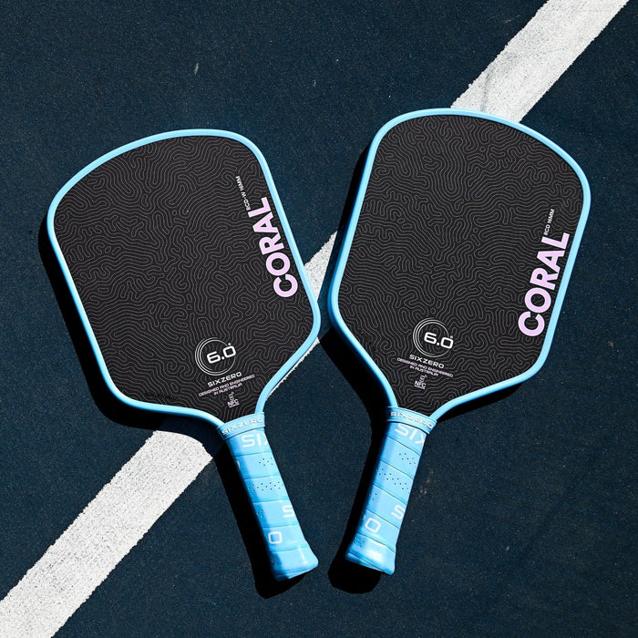Six Zero Coral Lightweight in Misty Blue, Hybrid and Widebody paddles side by side on court