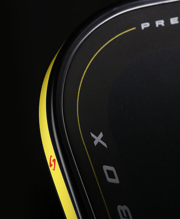 Close-up of the Pressure X 8E yellow perimeter edge and red Gearbox emblem