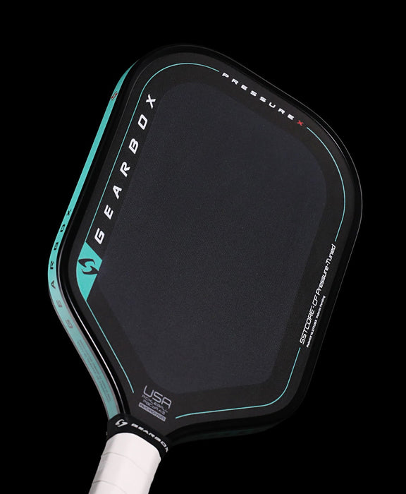Angled close-up of the Gearbox Pressure X 8M reverse face with USA Pickleball approval marking