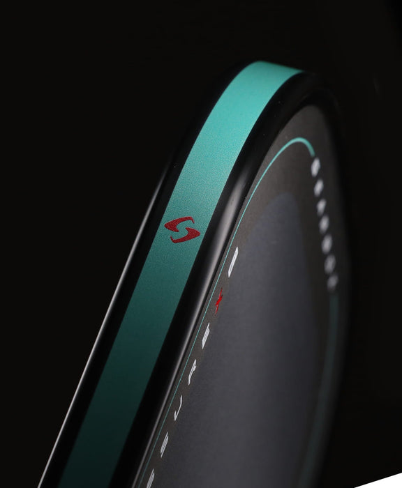 Close-up of the Gearbox Pressure X 8M teal edge with red Gearbox emblem and black perimeter trim