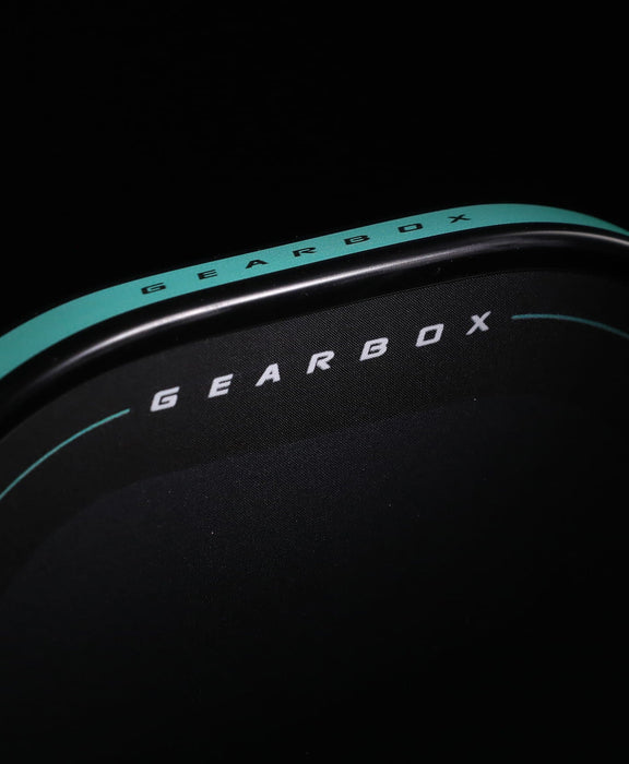 Close-up of the Gearbox Pressure X 8M rounded top edge and Gearbox lettering on the carbon face