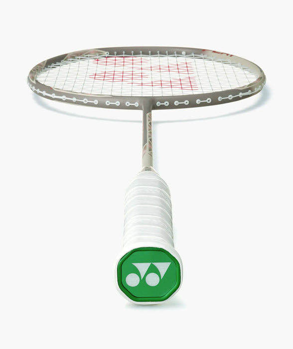 Yonex ASTROX 77 PLAY Light Beige badminton racket frame, grip and green end cap detail