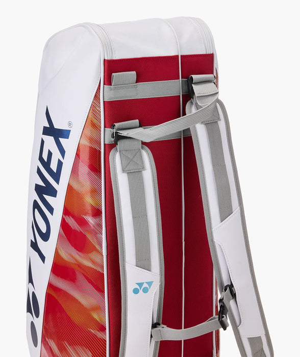 partial standing view of Yonex Expert Racquet Bag 6 PCS in white red showing adjustable padded shoulder straps