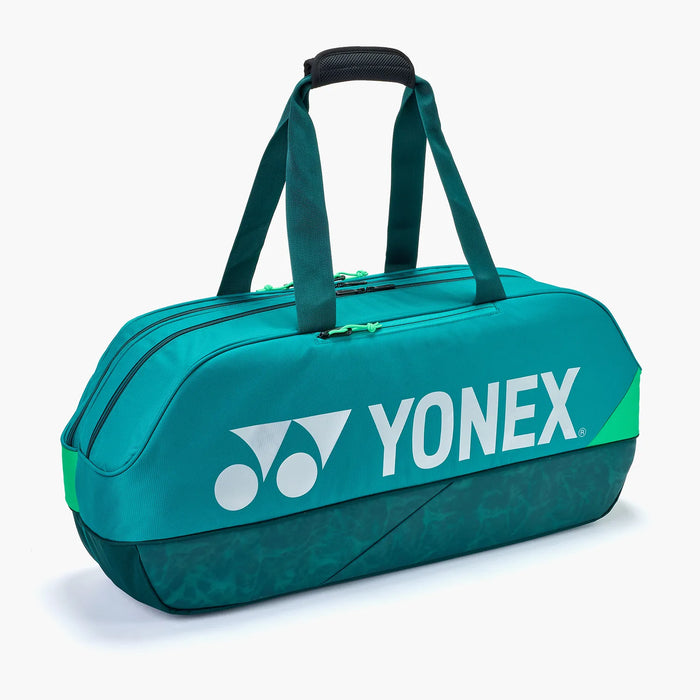 Yonex Pro Tournament Bag BA92431W in Dark Green side view with dual padded carry handles, multiple zippered compartments and large white Yonex logo