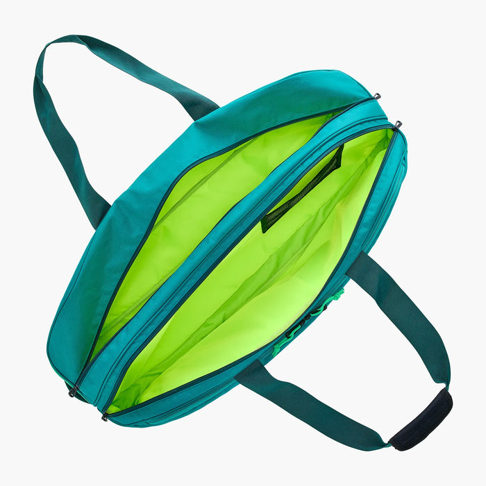 Open Yonex Pro Tournament Bag BA92431W in Dark Green showing multiple full-length compartments, bright green interior lining and mesh storage pocket