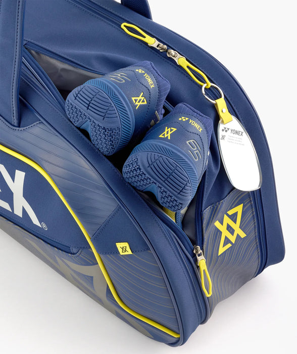 Separate shoe compartment on Yonex BA02631V bag, shown with court shoes