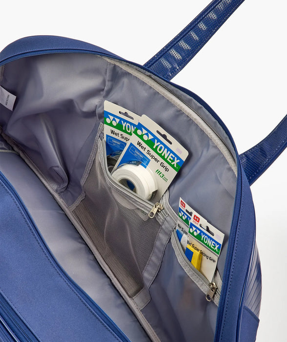 Interior mesh accessory pockets in Yonex BA02631V bag, shown holding grips